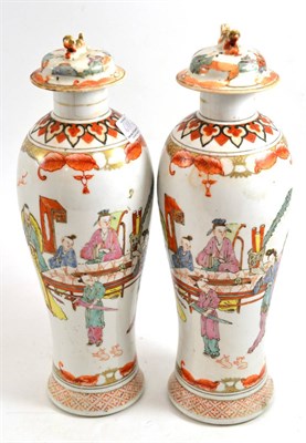 Lot 611 - A pair of Chinese porcelain vases and covers, late 18th/19th century, of slender baluster form, the