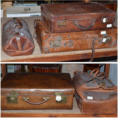 Lot 635 - Three vintage stitched leather suitcases of assorted sizes and two leather Gladstone bags