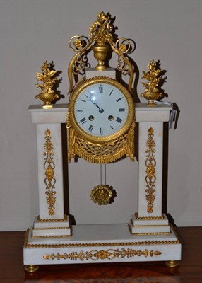 Lot 653 - A white marble striking portico mantel clock, circa 1850, gilt metal urn and floral mounts,...