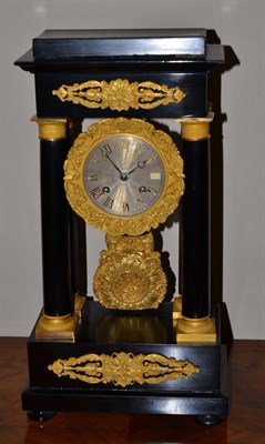 Lot 656 - An ebonised portico striking mantel clock, circa 1880, applied gilt metal scroll mounts,...