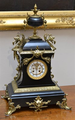 Lot 657 - A black slate and gilt metal mounted striking mantel clock, circa 1880, scroll and mask...