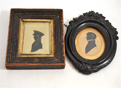 Lot 667 - Oval silhouette portrait depicting a young man wearing a ruff, contained within carved oval...