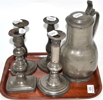 Lot 676 - A 17th century pewter flagon and a candlestick