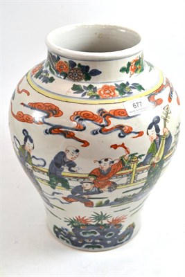 Lot 677 - A Chinese porcelain baluster vase, painted with women and boys on a veranda in famille verte...