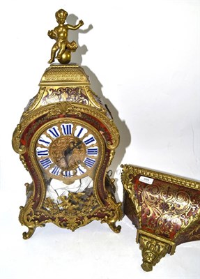 Lot 694 - A ";Boulle"; striking bracket clock with wall bracket, tortoiseshell and brass inlaid panels,...