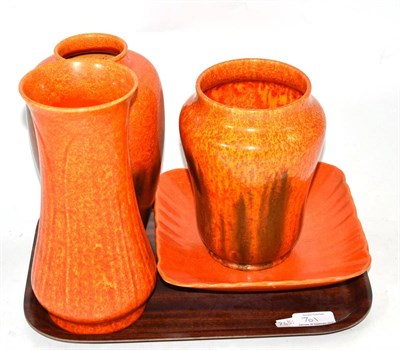 Lot 701 - Three Royal Lancastrian orange motel glazed vases and a square form dish