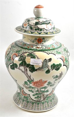 Lot 711 - Chinese porcelain baluster jar and cover in Kangxi style, painted in famille verte enamels with...