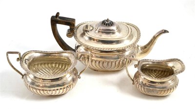 Lot 714 - A silver three piece tea set