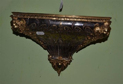 Lot 720 - A Boulle wall bracket in Louis XIV style, with mask angles and scroll decoration, 37cm wide