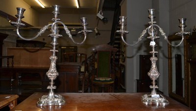 Lot 737 - A pair of Sheffield plate candelabra by Dickson