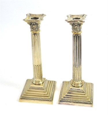 Lot 738 - A pair of electroplated candlesticks