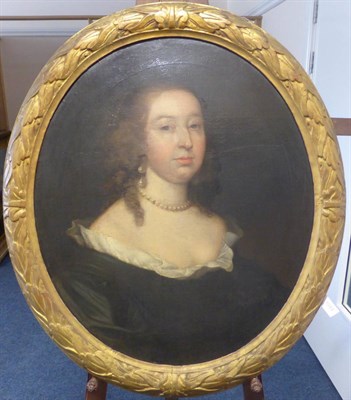 Lot 1044 - Follower of Sir P. Lely (1618-1680) A head and shoulders portrait of a lady wearing a black...