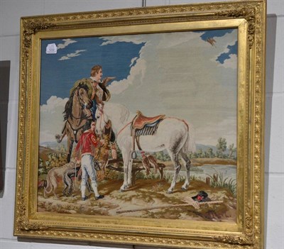 Lot 1232 - A Victorian needle work picture depicting 18th century figures with horses, contained within a gilt