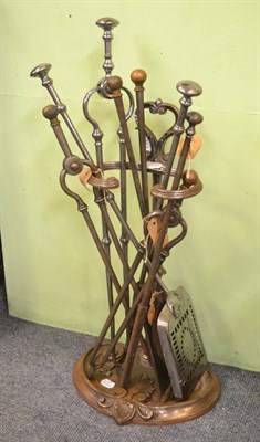 Lot 1247 - Cast iron stick stand, brass coal bucket with a quantity of steel and brass fire irons