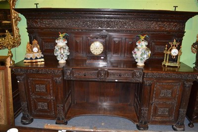 Lot 1250 - A large Victorian inlaid and carved oak sideboard, by J K Hood, the back with intricately...