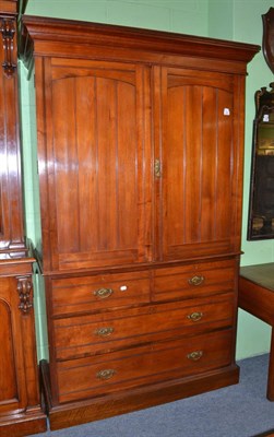 Lot 1260 - A late Victorian walnut linen press enclosed by two doors