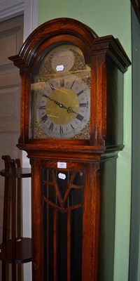 Lot 1267 - An oak cased longcase clock with glazed door and weight driven striking and chiming movement