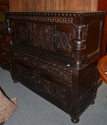 Lot 1272 - A 17th century ebonised and carved oak court cupboard