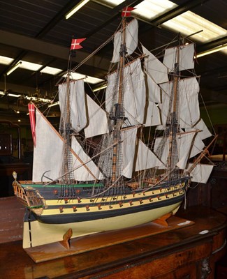 Lot 1284 - A painted model of an 18th century galleon, raised on an oak base, 76cm wide