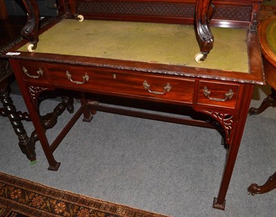 Lot 1295 - An Edwardian Chippendale revival writing table with leather top