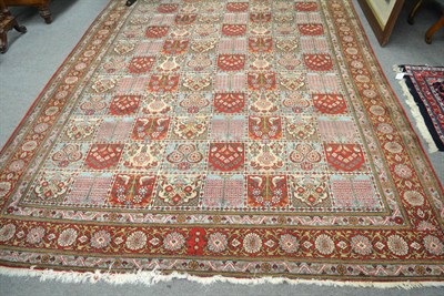 Lot 1308 - Ghom carpet, Central Persia, the polychrome compartmentalised field of trees and birds enclosed...