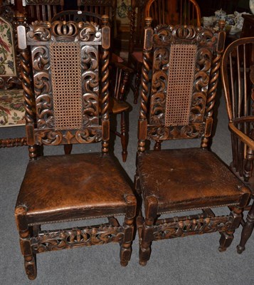 Lot 1320 - A pair of William and Mary style carved chairs with high backs and leather seats