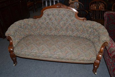 Lot 1340 - A late Victorian walnut framed small settee, button upholstered in floral tapestry