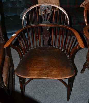 Lot 1342 - A 19th century yew and elm low Windsor armchair