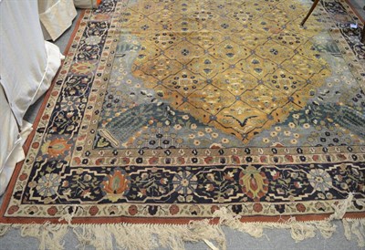 Lot 1352 - Motasham Kashan design carpet, Germany, the deep lemon diamond lattice field of stylised plants...