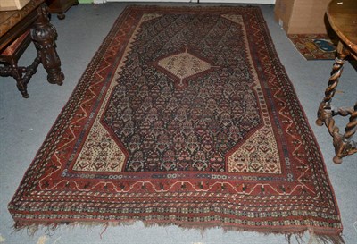 Lot 1357 - Kashgai rug, South West Persia, 19th century, the deep indigo field of stylised plants around a...