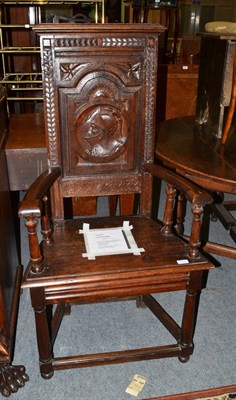 Lot 1362 - A French joined oak caquetoire chair with carved panel back depicting Francois I Provenance:...