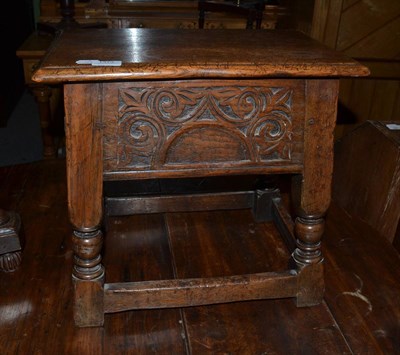 Lot 1373 - An English joined oak stool with hinged lid