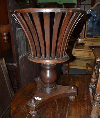 Lot 1374 - A mahogany planter with slatted body