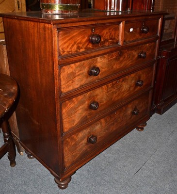 Lot 1375 - A Victorian mahogany chest of drawers with turned handles and turned peg feet