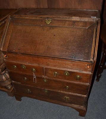 Lot 1385 - An early 18th century oak bureau