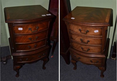 Lot 1395 - A pair of Georgian style pedestal chests of four drawers on cabriole legs, 20th century