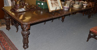 Lot 1410 - A large Victorian oak dining table, with wind action and five leaves