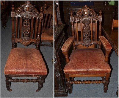 Lot 1411 - A set of ten carved oak dining chairs including two carvers