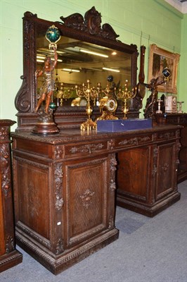 Lot 1414 - A large oak pedestal sideboard with mirror back