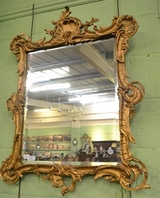 Lot 1423 - Gilt and gesso Rococo style bevel glass mirror