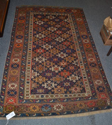 Lot 1431 - Antique Kuba rug, North East Caucasus, the indigo lattice field of polychrome stylised...