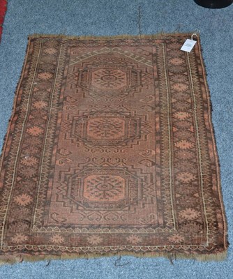 Lot 1440 - An Ushak Carpet, Central Anatolia, the tomato red field with rows of medallions enclosed by...