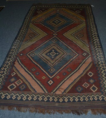 Lot 1442 - Kashgai Kilim, South West Persia, the polychrome field of stepped diamonds enclosed by...