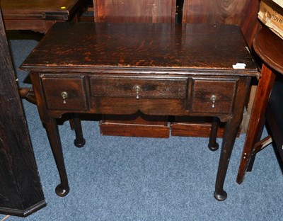 Lot 1463 - An 18th century oak lowboy fitted three drawers