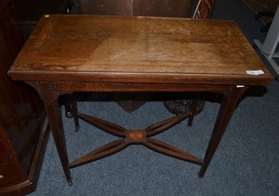 Lot 1465 - * Late Victorian rosewood fold-over tea table on square tapering legs, 90cm wide