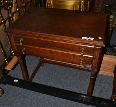 Lot 1472 - * A 1920's oak two drawer table containing mainly silver-plated flat ware