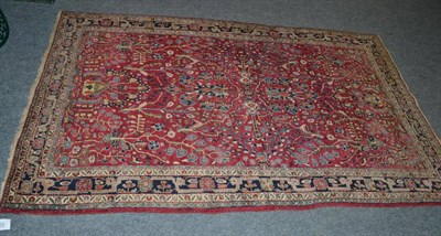 Lot 1479 - Jozan rug, West Persia, the raspberry field with flowing vines and plants enclosed by narrow...