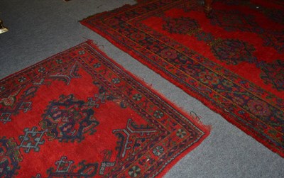 Lot 1480 - * Ushak carpet, Central Anatolia, the tomato red field with three rows of guls enclosed by stylised