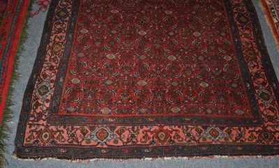 Lot 1481 - Bidjar rug, Persian Kurdistan, the madder field of Herati design enclosed by coral pink borders...