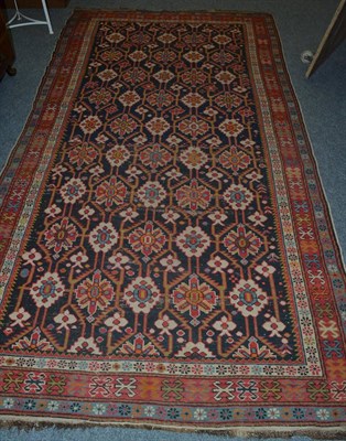 Lot 1483 - Shirvan rug, East Caucasus, the deep indigo field with columns of stylised flowerheads enclosed...